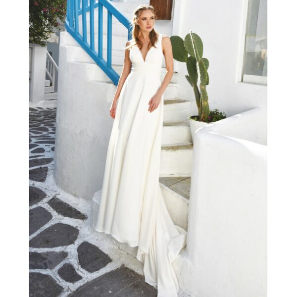Robe de mariée longue Marina. Robe bohème chic disponible dans notre boutique mariage à Paris 11ème. Prendre un RDV privé