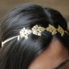 Headband feuilles dorées Monic. Accessoire de cheveux doré et coloré pour mariée. Acheter en ligne sur notre site et dans notre boutique à Paris