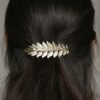 Accessoire de cheveux barrette feuilles bronze doré. Accessoire de tête pour mariée bohème pour chignon ou coiffure wavy. Acheter boutique Paris ou en ligne