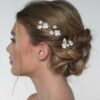 Pic à chignon de mariée fleurs de porcelaines. Accessoire de cheveux mariage. Achat en ligne ou boutique mariage paris coiffure