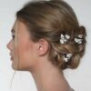 Pic à chignon de mariée fleurs de porcelaines. Accessoire de cheveux mariage. Achat en ligne ou boutique mariage paris coiffure