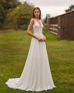 Robe de Mariée Nemira collection Alma Novia 2026. Robe dentelle fluide nature champêtre sans manche. Essayer boutique mariage showroom Paris
